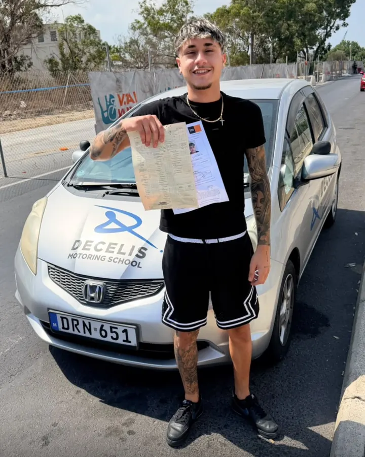 A new driver on pass day, in front of a Decelis Honda Jazz